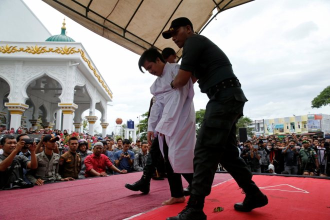 Gay couple in Indonesia caned 83 times in public