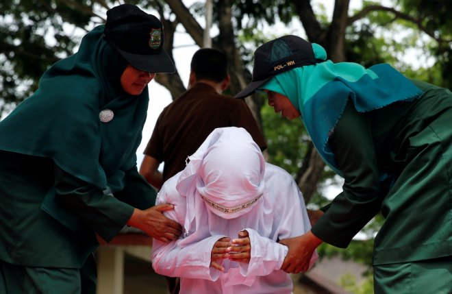 Gay couple in Indonesia caned 83 times in public