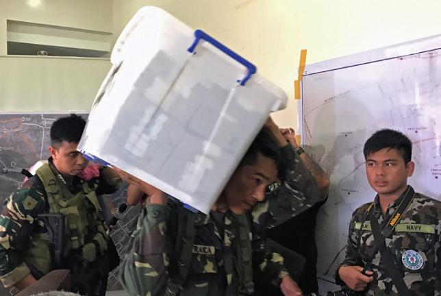 Philippine troops find stash of banknotes as fighters pull back