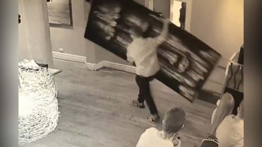 Watch really unsutble thief run off with giant painting
