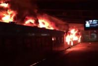 Angry South African commuters torch trains and riot at Cape Town railway station