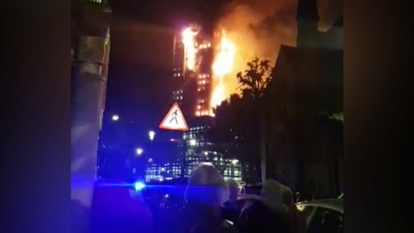 Video shows onlookers staring at burning tower in London