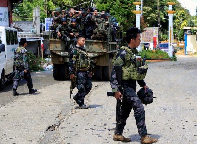Philippines says Islamist militants withdraw from school, no casualties