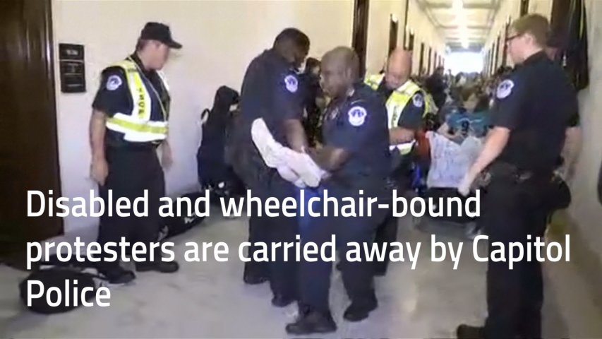 Police drag away protesters in wheelchairs from Mitch McConnells office