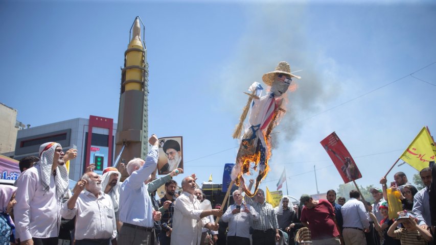 Protesters burn American, Israeli  and amp; Isis flags during Al-Quds day march in Iran
